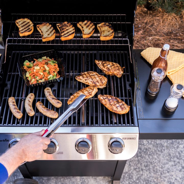 Char-Broil Performance 4 Burner Gas Grill, Cart Design cooking a variety of meats.