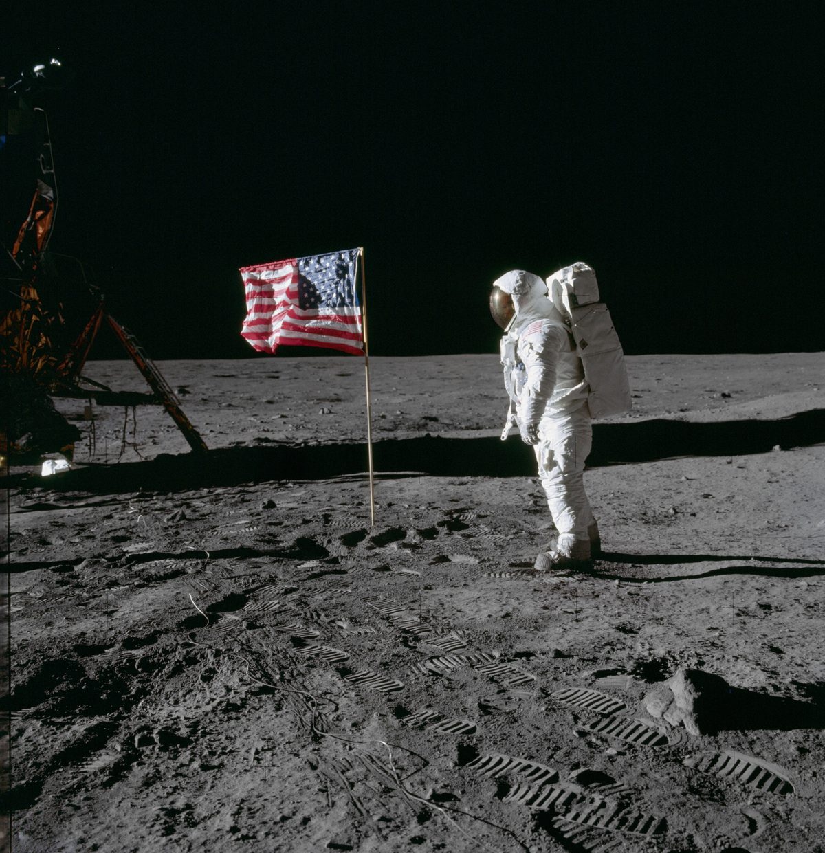 Photo of an astronaut with an American flag on the moon by NASA taken on a Hasselblad camera during the Apollo missions