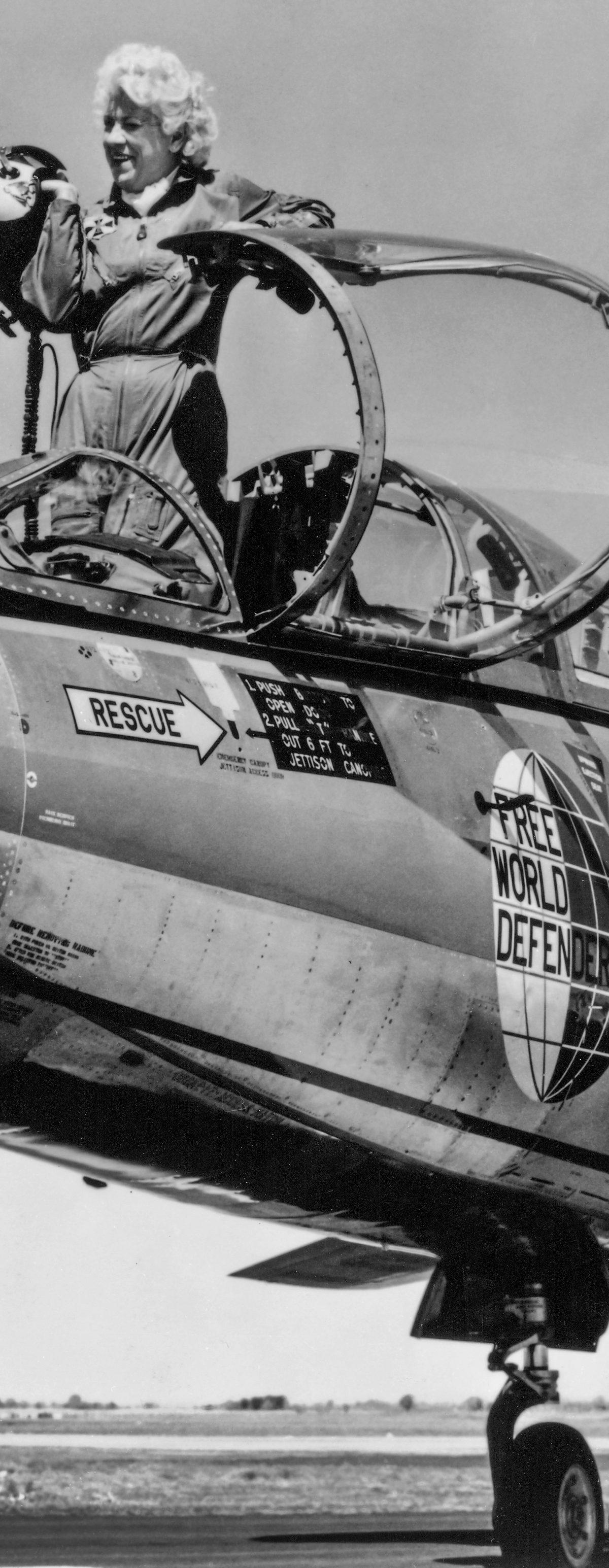 Jacqueline Cochran stands in the cockpit of a F-104 Starfighter jet