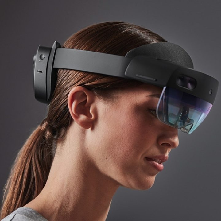 A Microsoft HoloLens 2 headset on a woman's head.