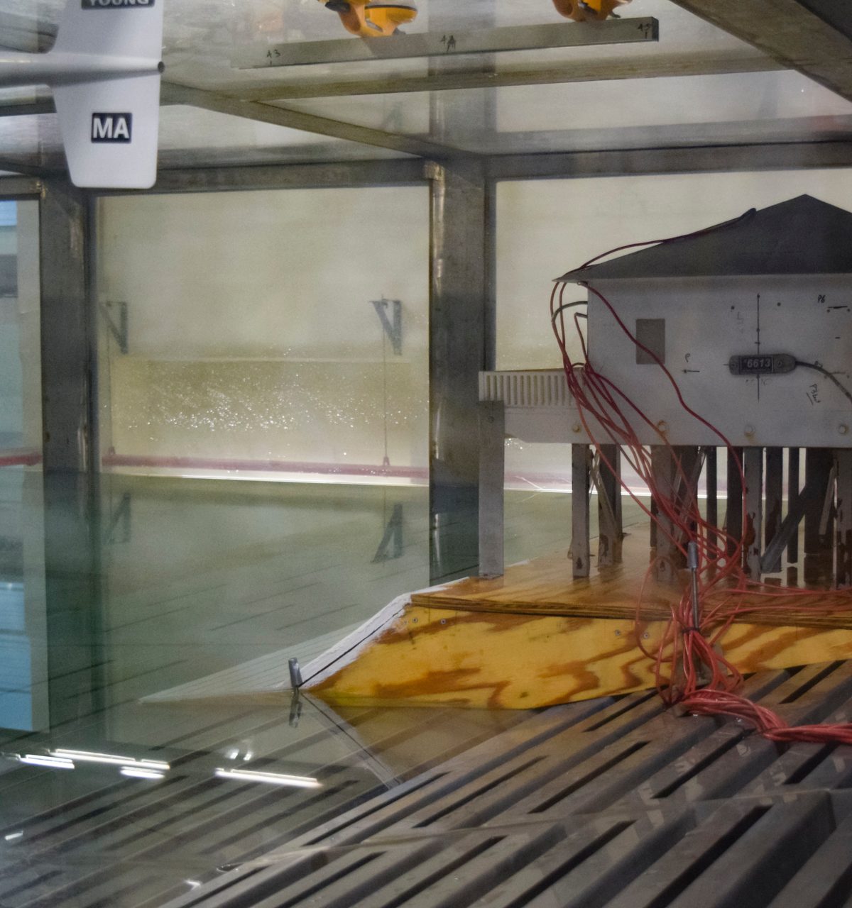 The Surge Structure Atmosphere Interaction Facility's hurricane simulator launches hurricane force winds at a model house