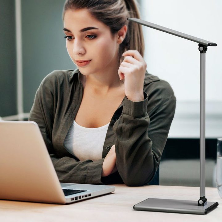 Student using the Moko LED Desk Lamp.