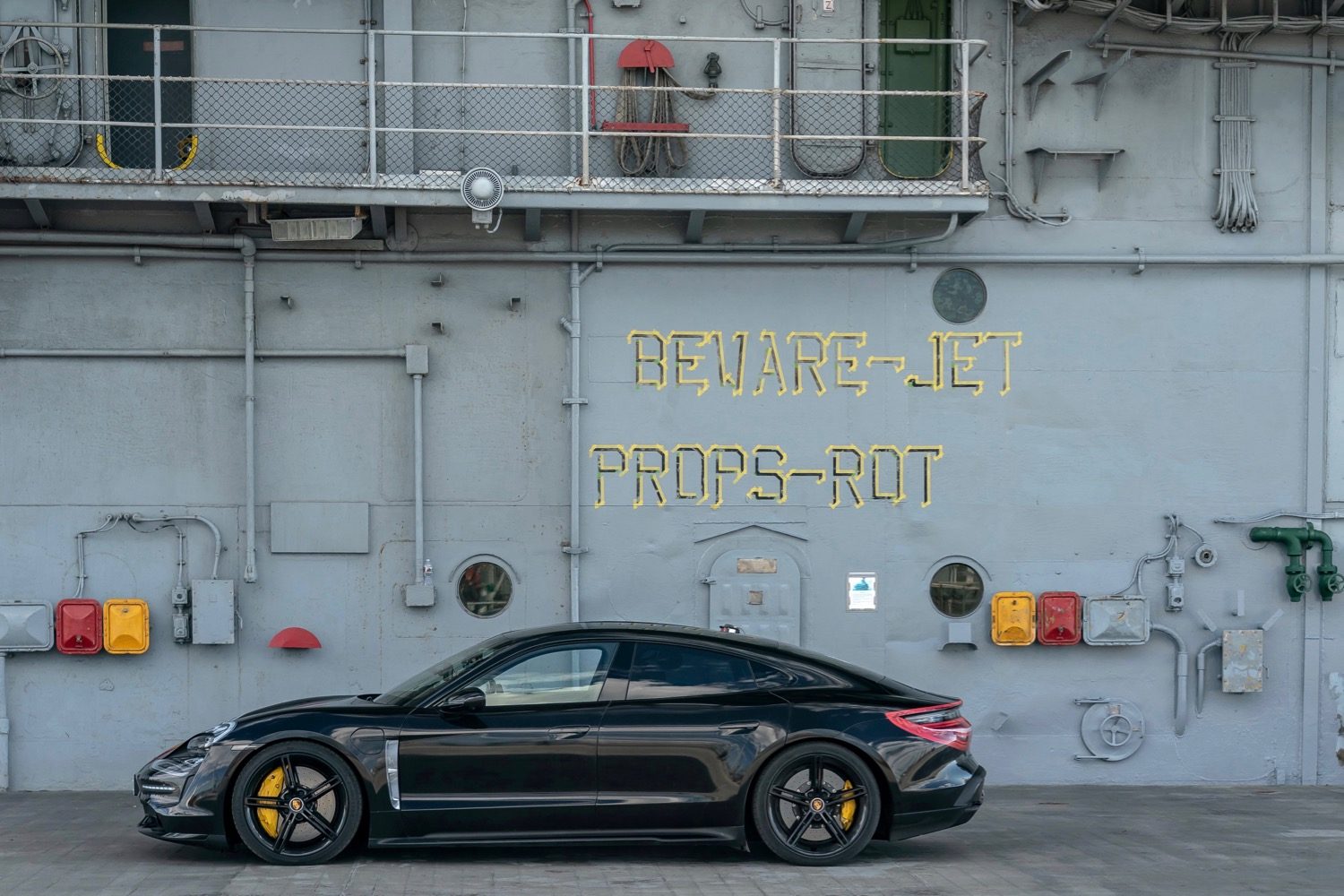 porsche taycan electric car acceleration test on aircraft carrier deck prototype