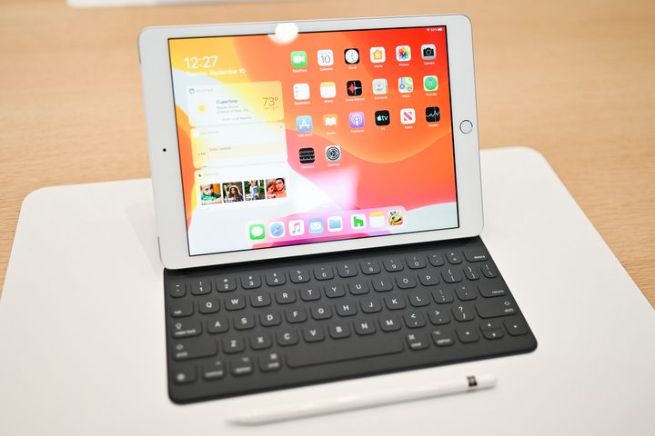 iPad 7th generation hands-on sitting on table with pencil in front