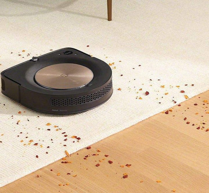 The iRobot Roomba s9 cleaning.