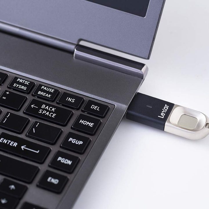 The Lexar Jumpdrive Fingerprint Reader inserted into a laptop.