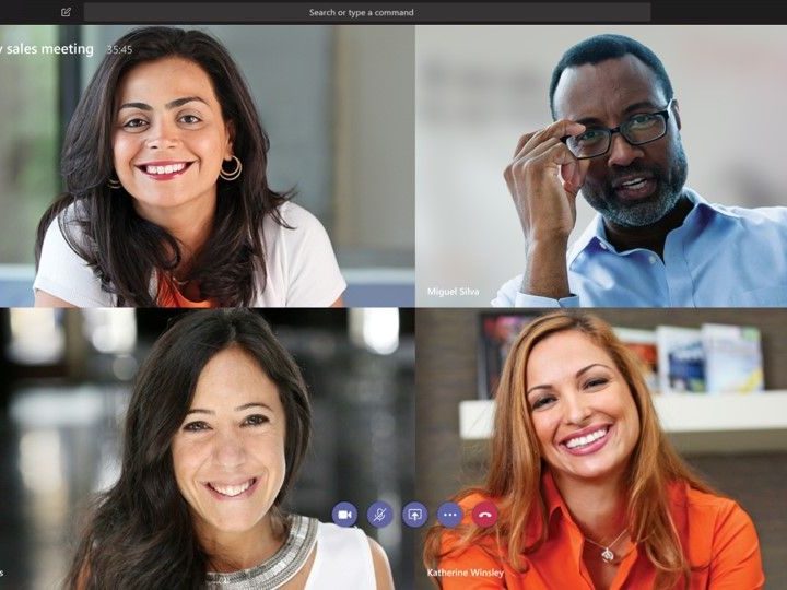 Four people on a video call for a monthly sales meeting.