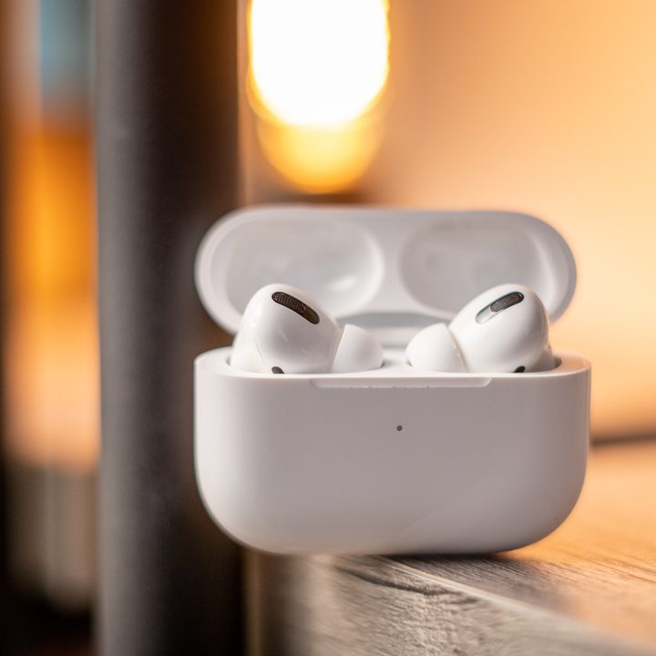 The Apple AirPods Pro inside their wireless charging case.