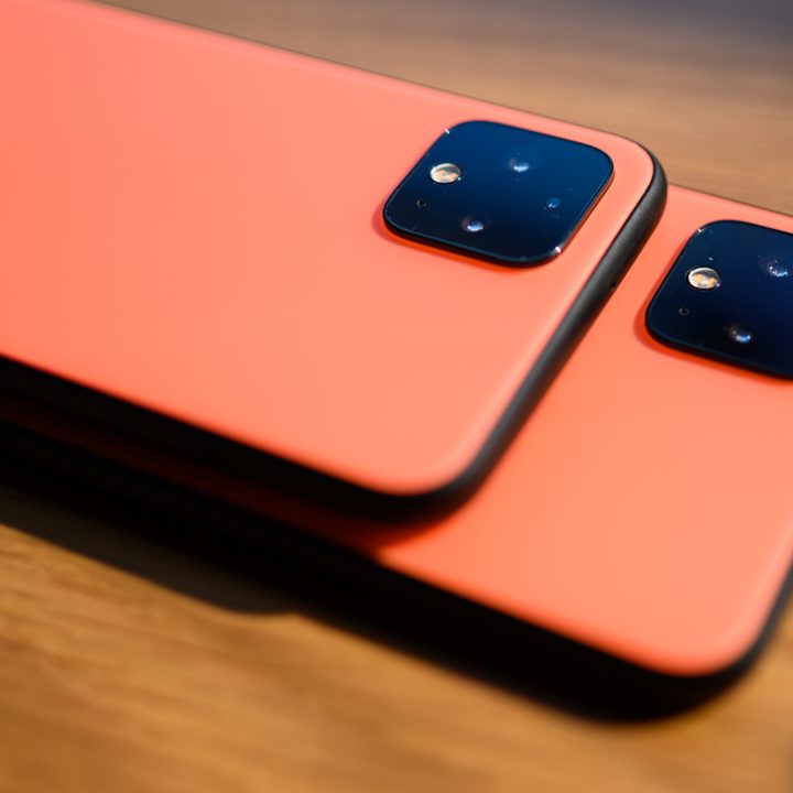 Two Pixel 5 phones lying face down on table.