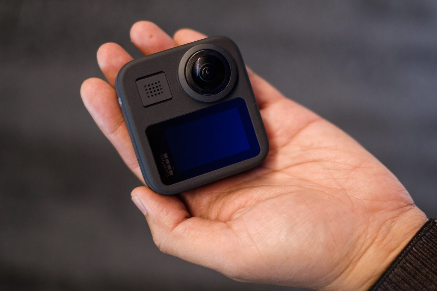GoPro Max 360 camera in hand, back