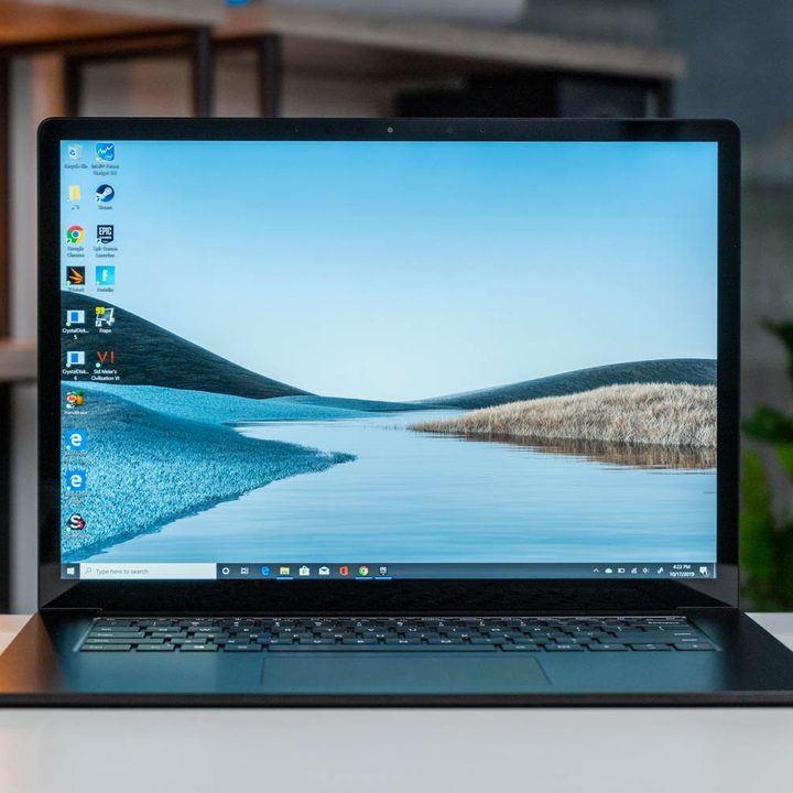 The Microsoft Surface Laptop 3 with a nature scene on the display.