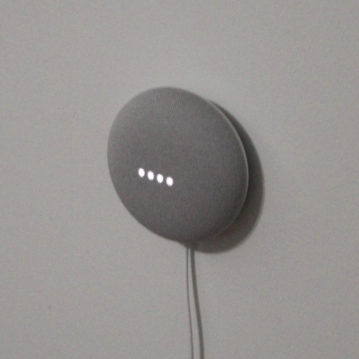 Google Nest Mini on a wall.