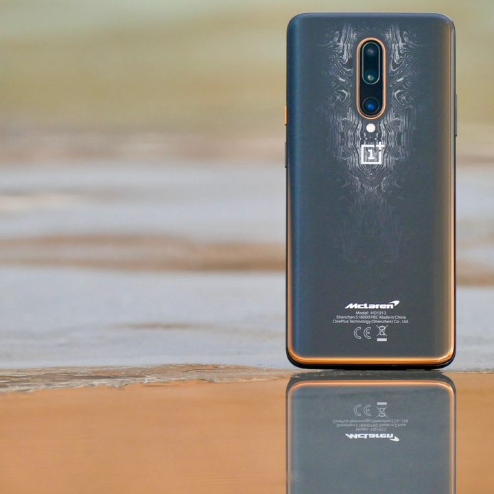 The OnePlus 7T Pro McLaren Edition on a beach.