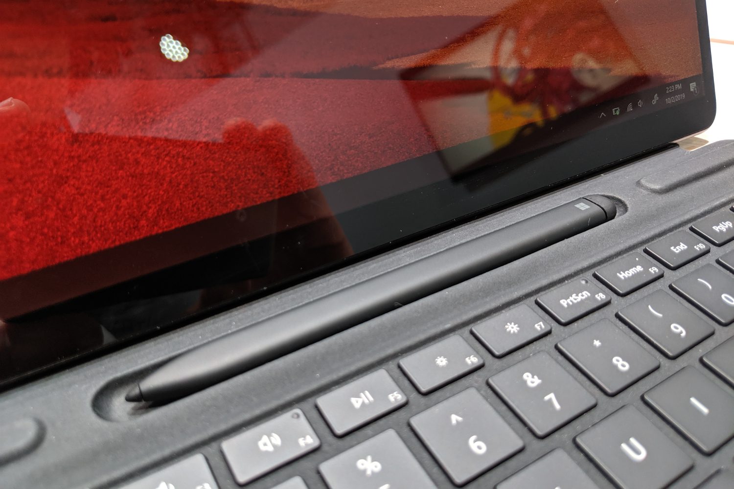 Microsoft's Surface Slim Pen resting in the Type Cover keyboard.