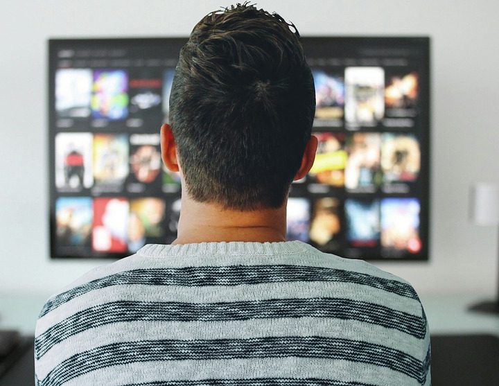 A person watching TV.