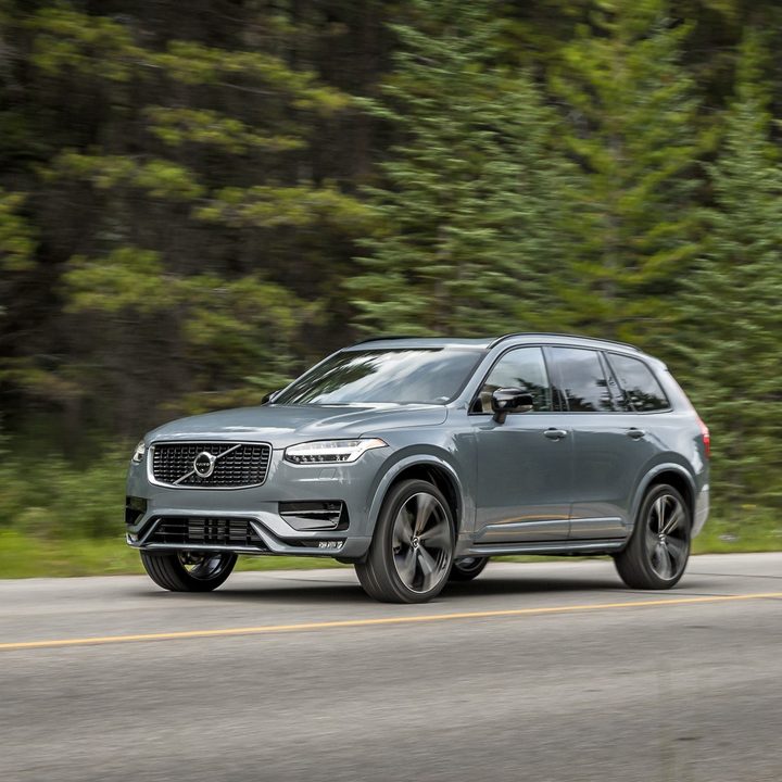 A grey 2020 Volvo XC90-R driving on a road.