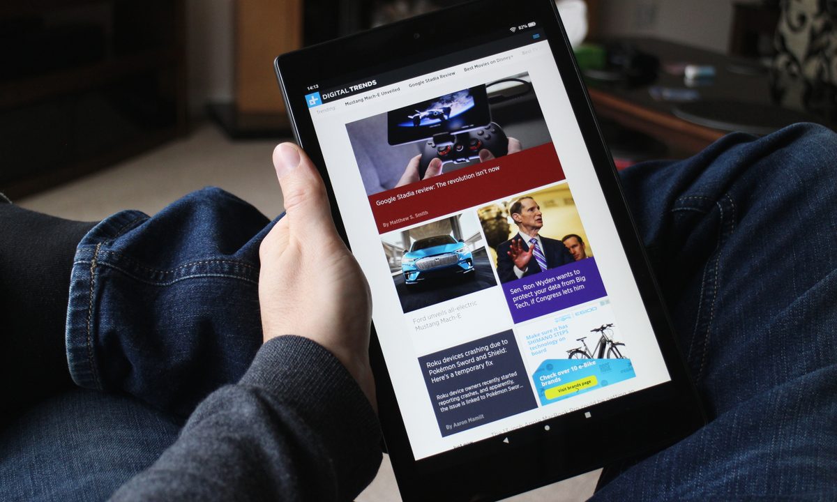 The Amazon Fire HD 10 tablet in hand.