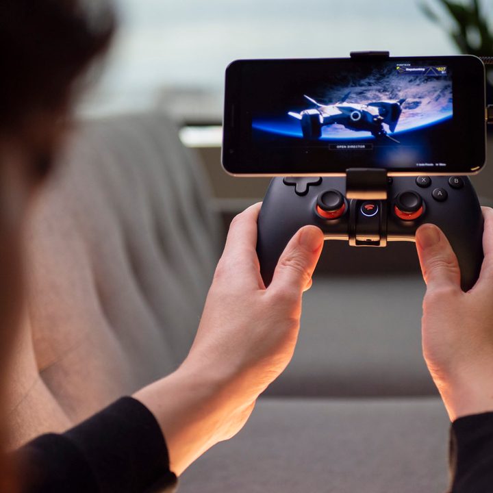 A gamer plays Destiny 2 on a phone via Google Stadia.