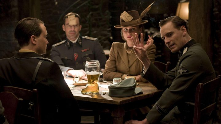 People sit around a table in Inglourious Basterds.
