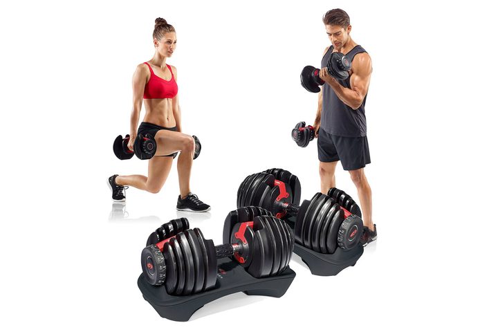 man and woman with selecttech dumbbells
