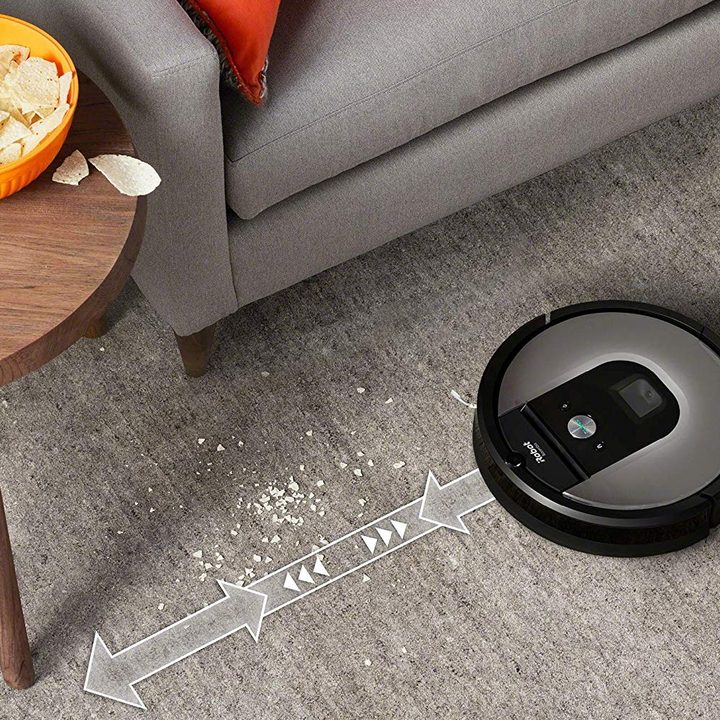 The iRobot Roomba 960 cleaning a living room.
