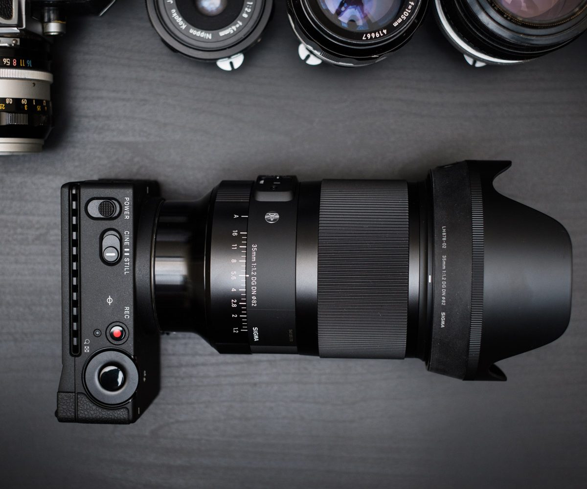 Sigma fp on table with 35mm F1.2 Art lens mounted.