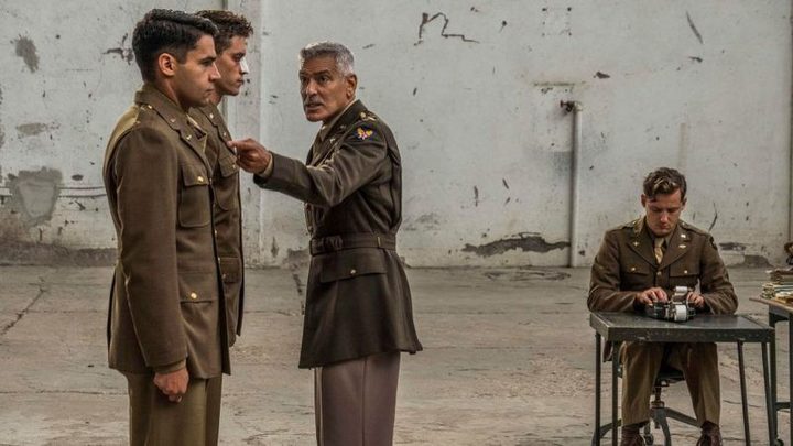 George Clooney yells at two soldiers.