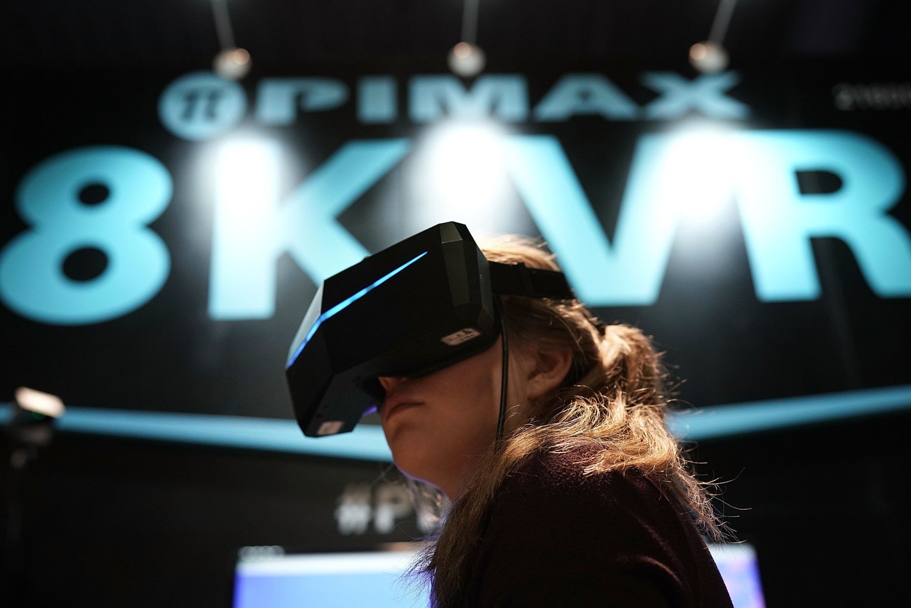 Woman wearing a VR headset at CES