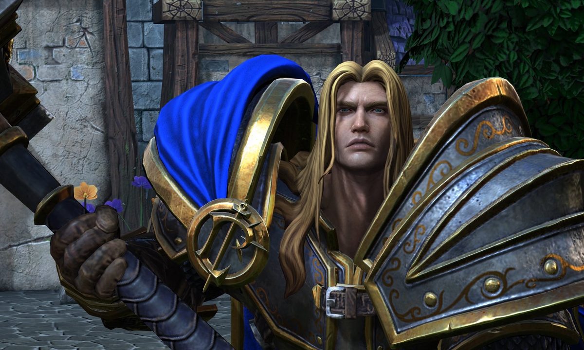 Warcraft 3 Reforged main character holds a hammer and stares at the camera.