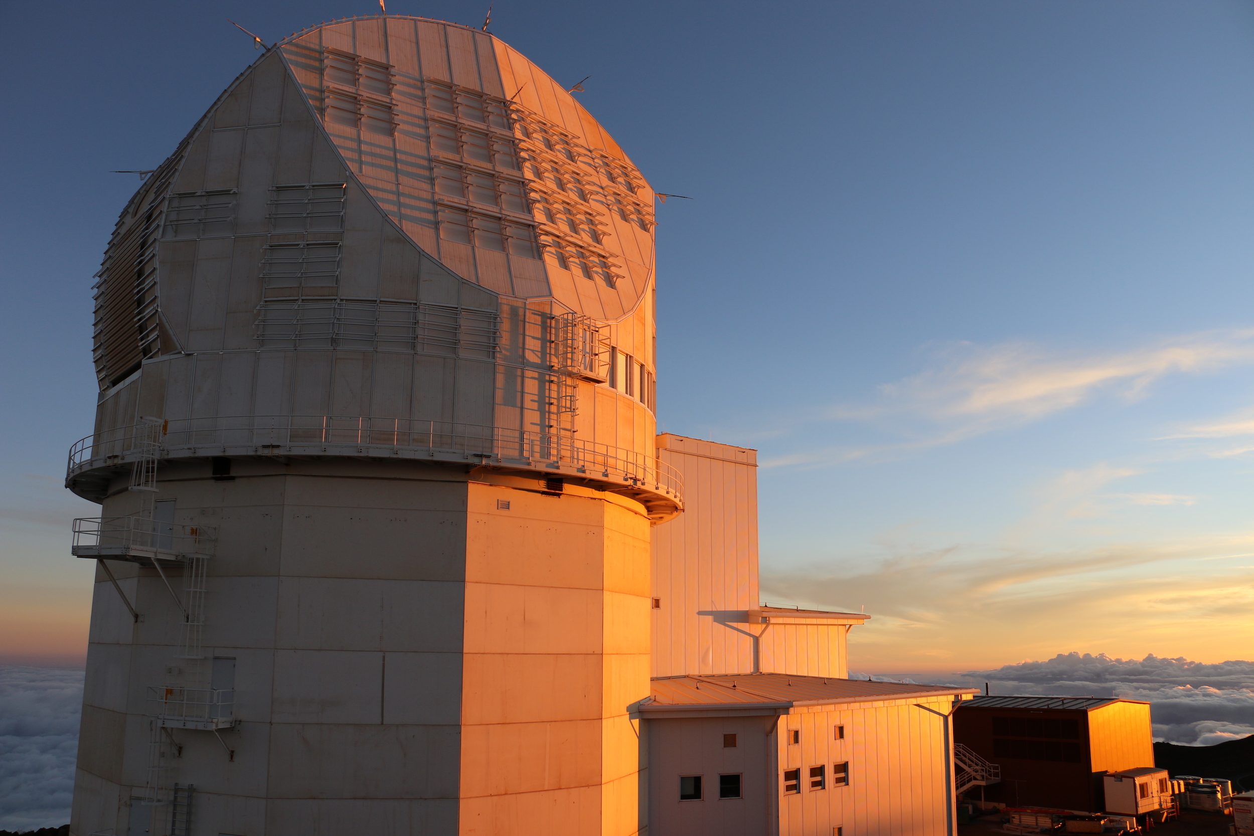 The National Science Foundation’s Inouye Solar Telescope sits atop Maui’s Haleakala as the Sun sits low on the horizon.