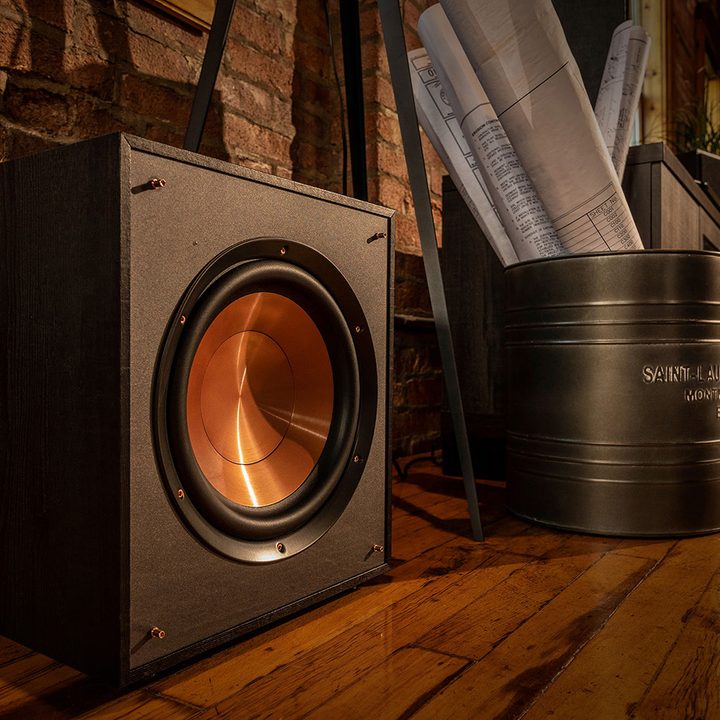 A Klipsch R-10SWi wireless subwoofer sits on a floor.