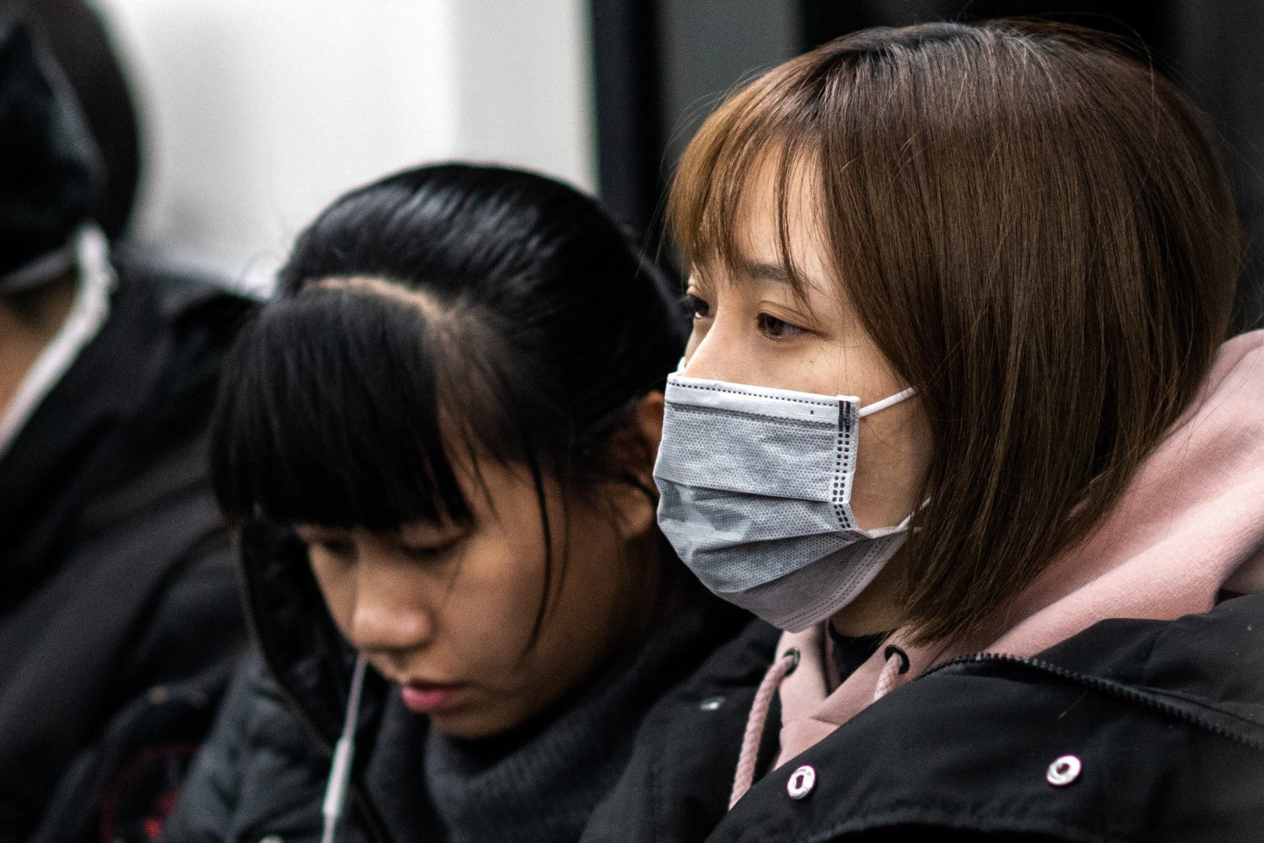 Woman wearing coronavirus mask on Beijing subway