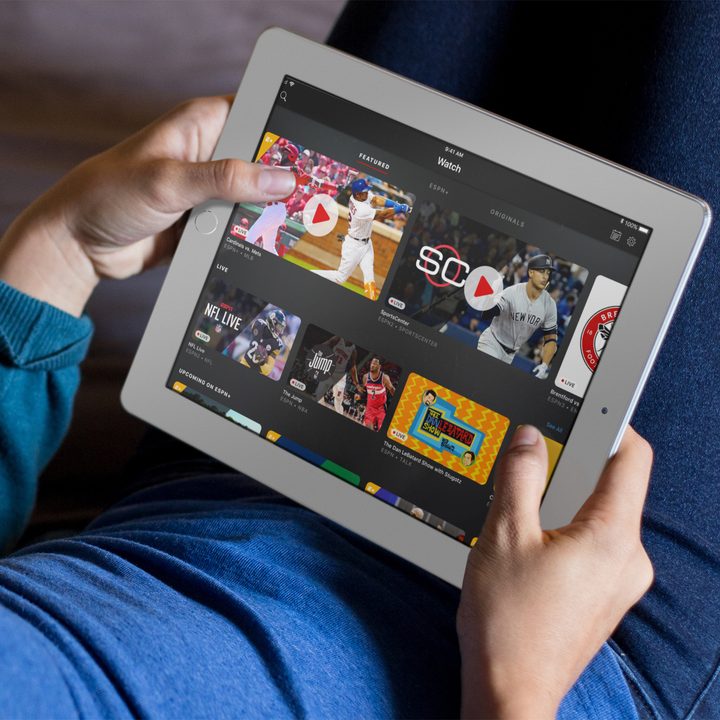 A person browsing the ESPN+ app on an iPad.