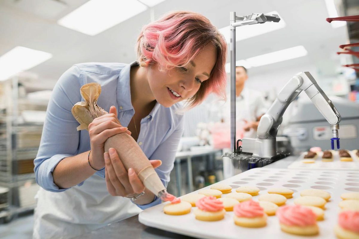 Flippy assisting a chef in a kitchen