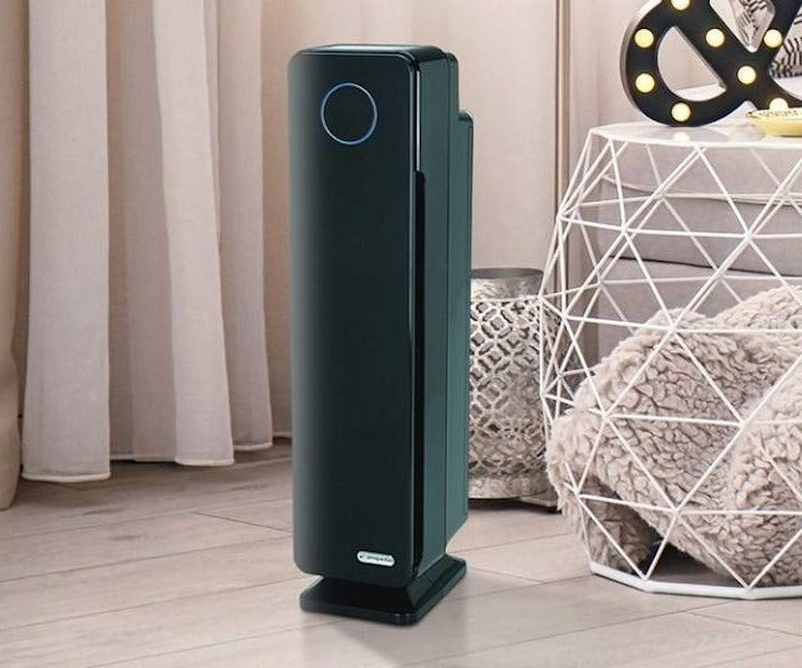 A Germ Guardian purifier placed on a living room floor.