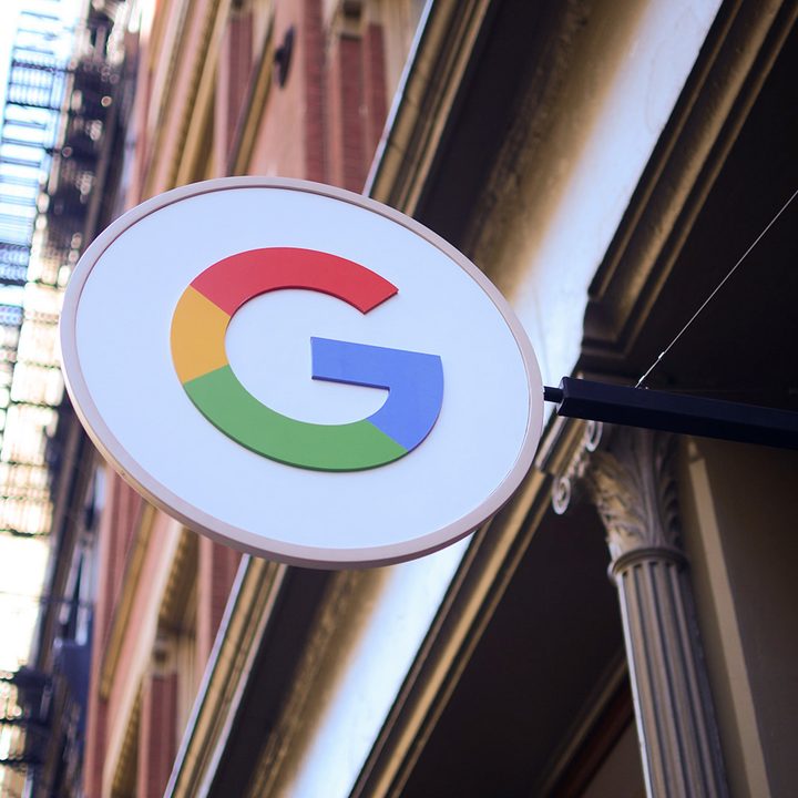 Google Logo outside of a city building.