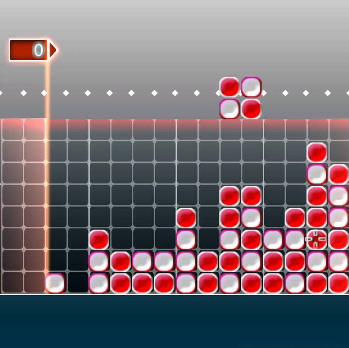 Red and white blocks being dropped on a grid.