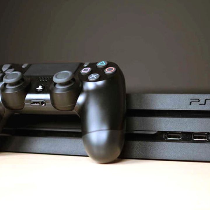 A Sony PlayStation 4 Pro and controller.