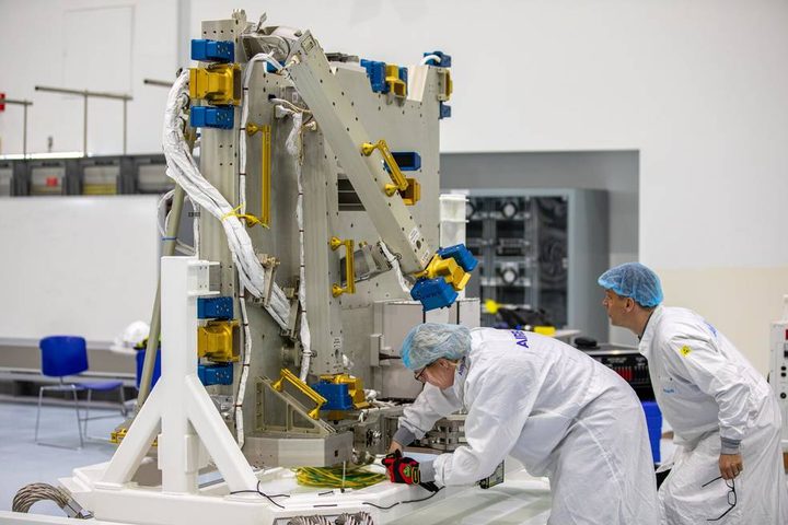 Airbus workers unpack the Bartolomeo platform at NASA’s Kennedy Space Center in Florida in preparation for its launch to the International Space Station.