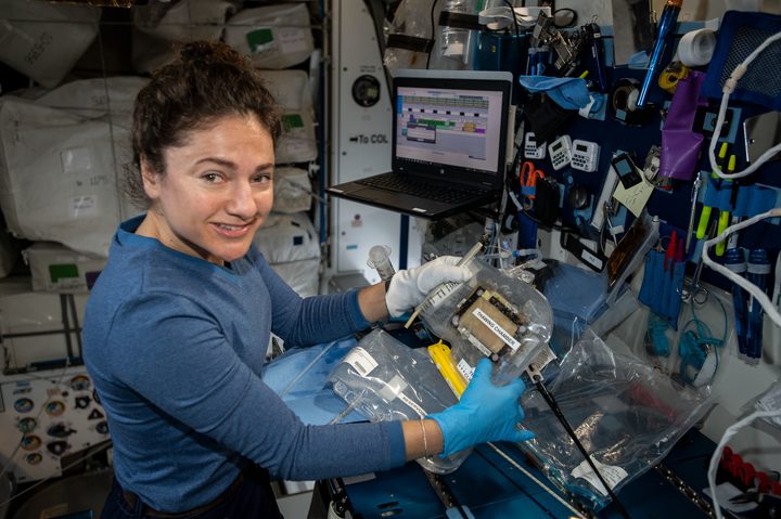 Expedition 62 Flight Engineer Jessica Meir works with research hardware to support the OsteoOmics-02 bone investigation.