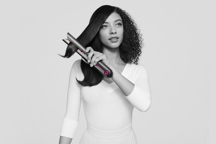Woman using the Dyson Corrale