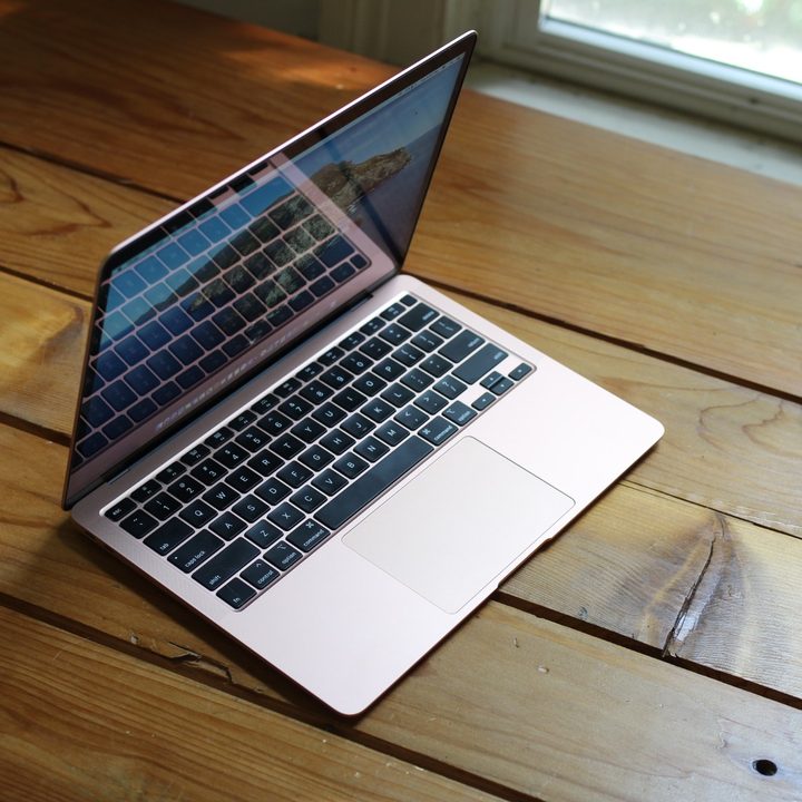 The 2020 MacBook Air M1 on a wooden table.