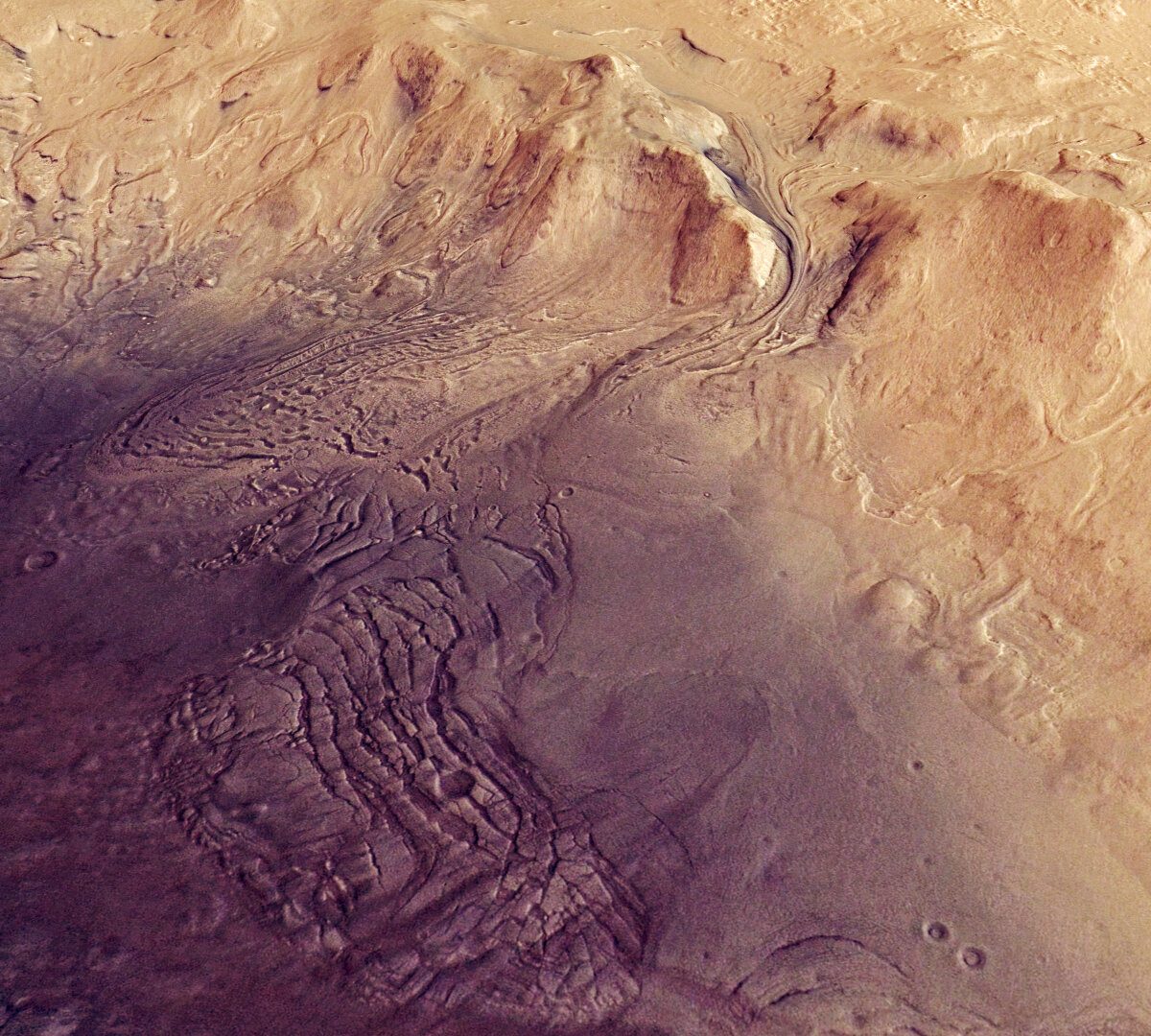 This image shows a feature on Mars’ surface named Moreux crater. It comprises data gathered on 30 October 2019 during orbit 20014. The ground resolution is approximately 16 m/pixel and the images are centred at about 44°E/42°N.