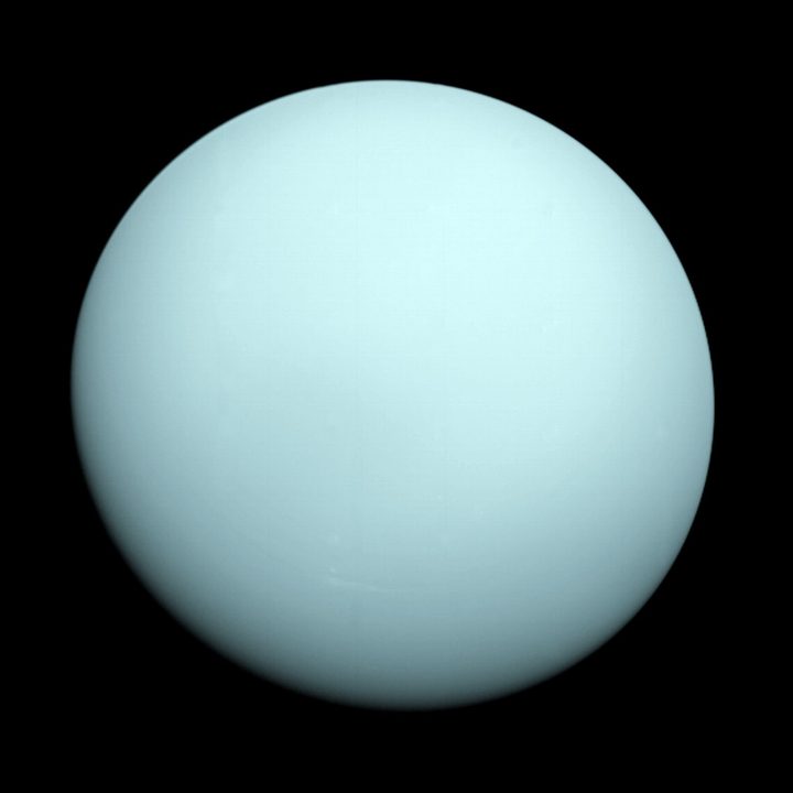 Voyager 2 took this image as it approached the planet Uranus on Jan. 14, 1986. The planet's hazy bluish color is due to the methane in its atmosphere, which absorbs red wavelengths of light.