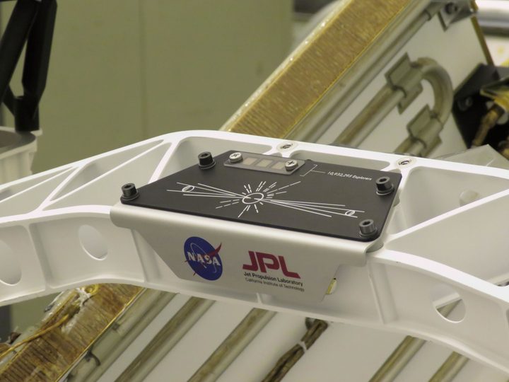 A placard commemorating NASA's "Send Your Name to Mars" campaign was installed on the Perseverance Mars rover on March 16, 2020, at Kennedy Space Center. Three silicon chips (upper left corner) were stenciled with 10,932,295 names and the essays from 155 finalists in NASA's "Name the Rover" contest.