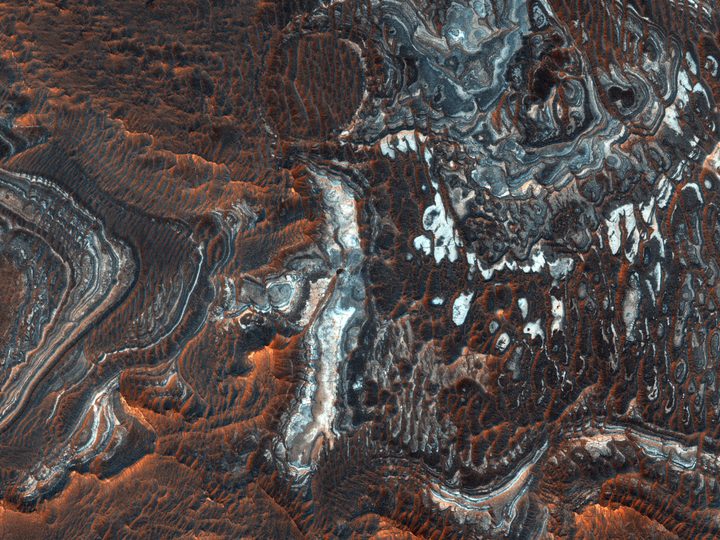 This image shows plains North of the Southwestern Juventae Chasma, a canyon part of the gigantic Valles Marineris system.