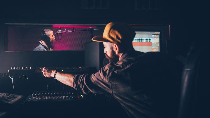 A recording engineer at a digital audio workstation.