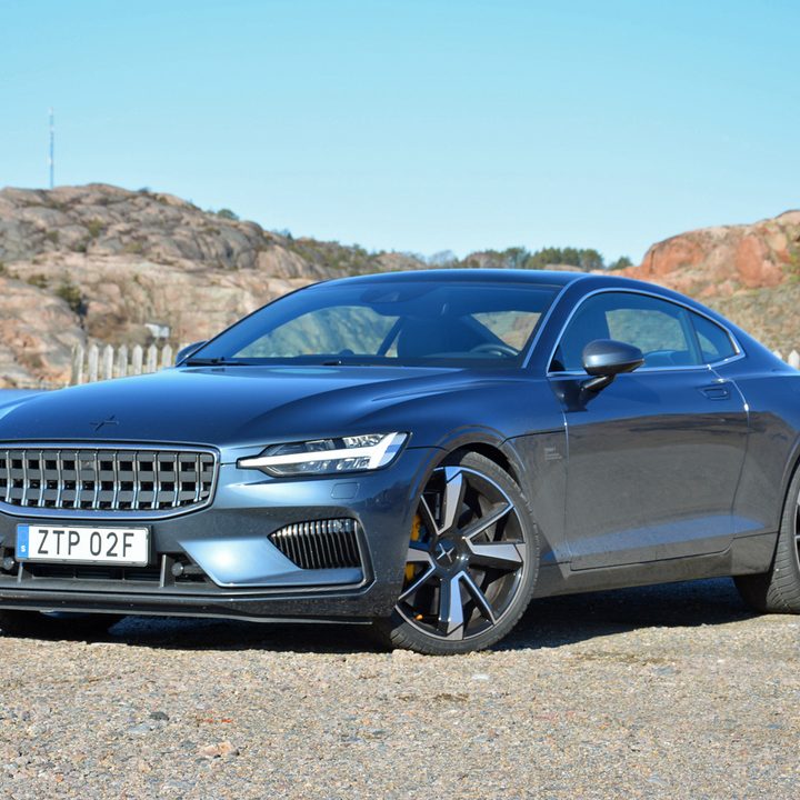 A 2020 Polestar 1 parked near a body of water.