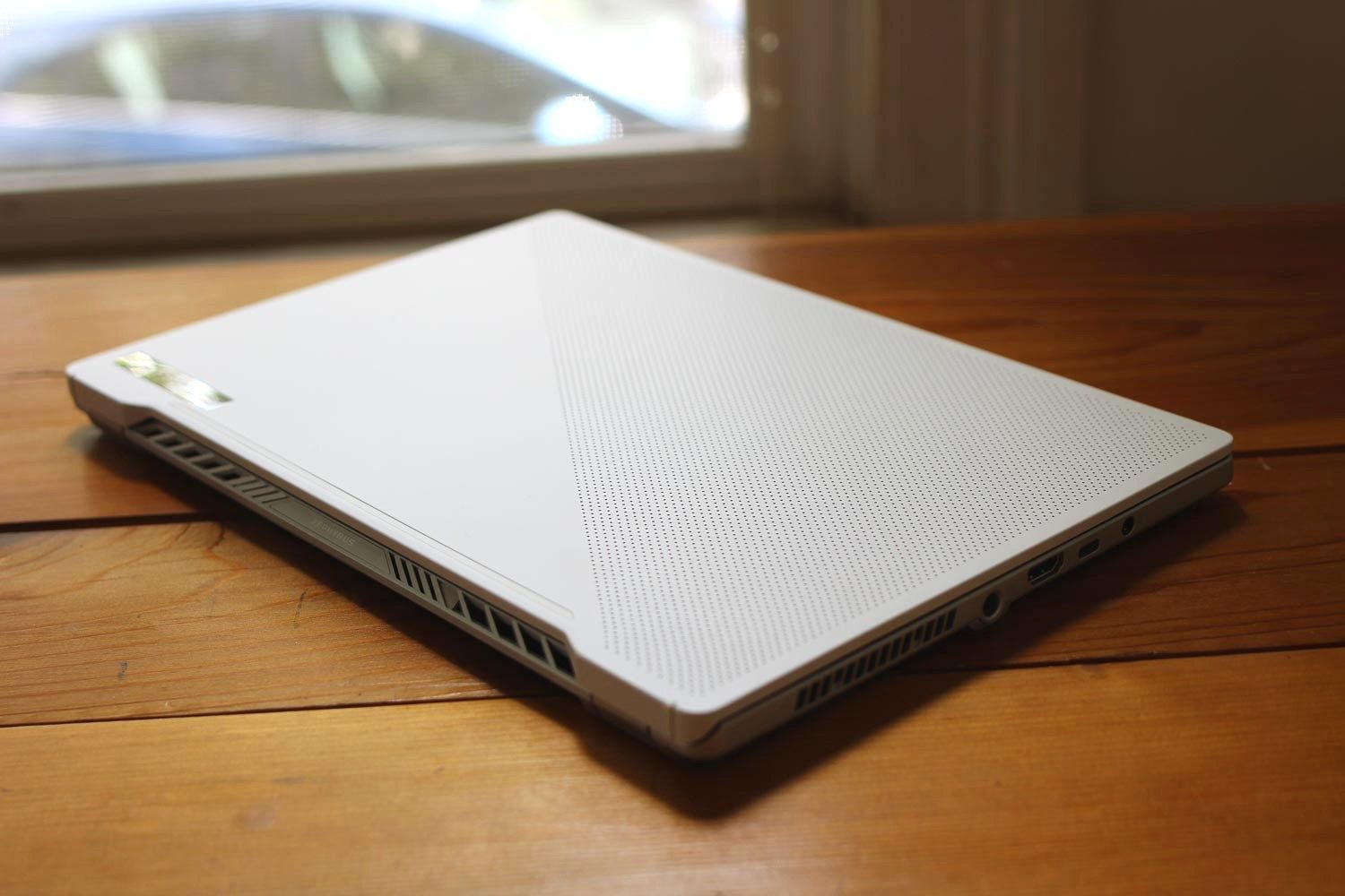 Asus ROG Zephyrus G14 top view showing dots and vents.
