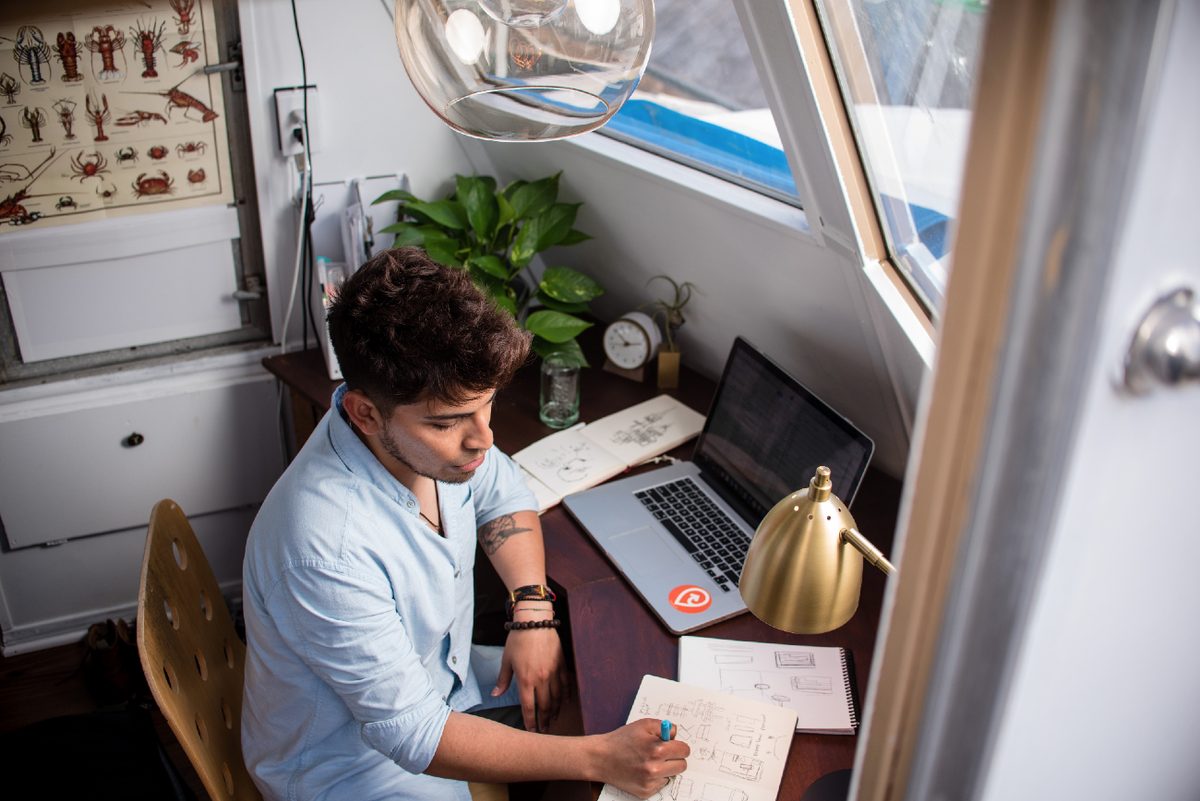 man working at a desk at home